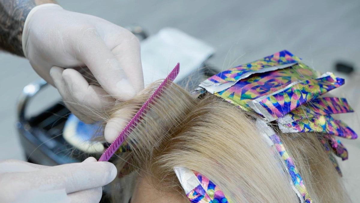Colourist working with Vellen Hair foil and a highlighting comb